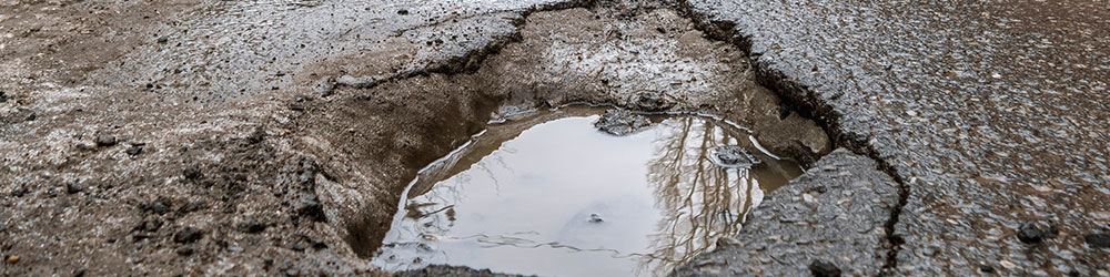 How to Avoid & Prevent Pothole Damage to Your Vehicle, Youngs Insurance, Ontario